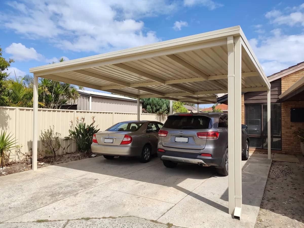 A double Colorbond carport over a driveway at a Perth home