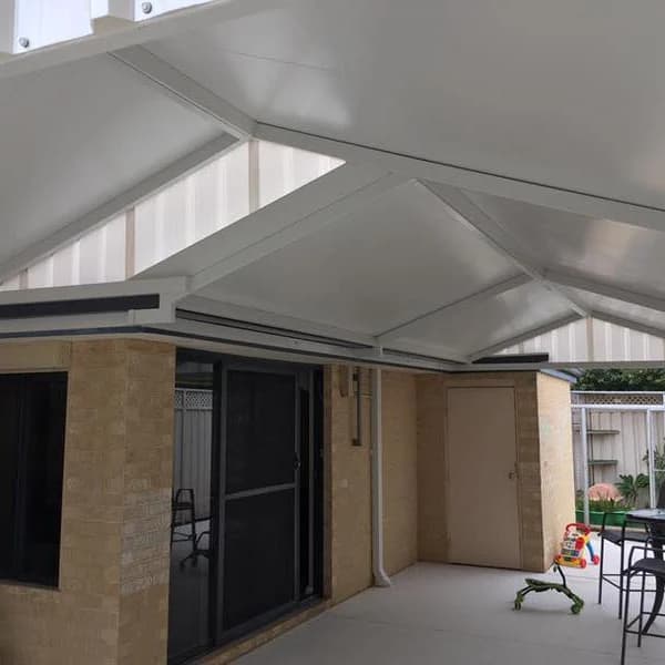 An insulated gable patio attached to a brick Perth home, with a smooth flat underside to the roof panels