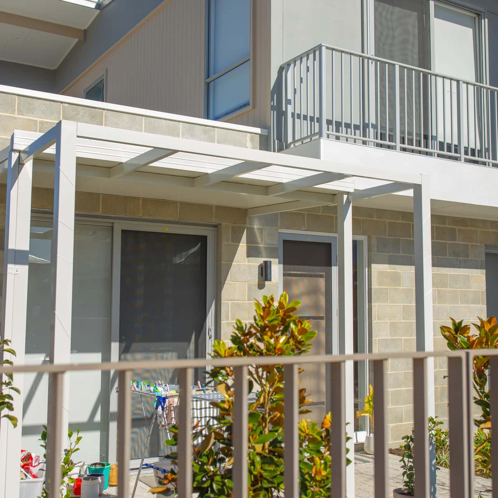 An attached outdoor structure at a Perth home, showing the frame and posts common to both a pergola and a patio