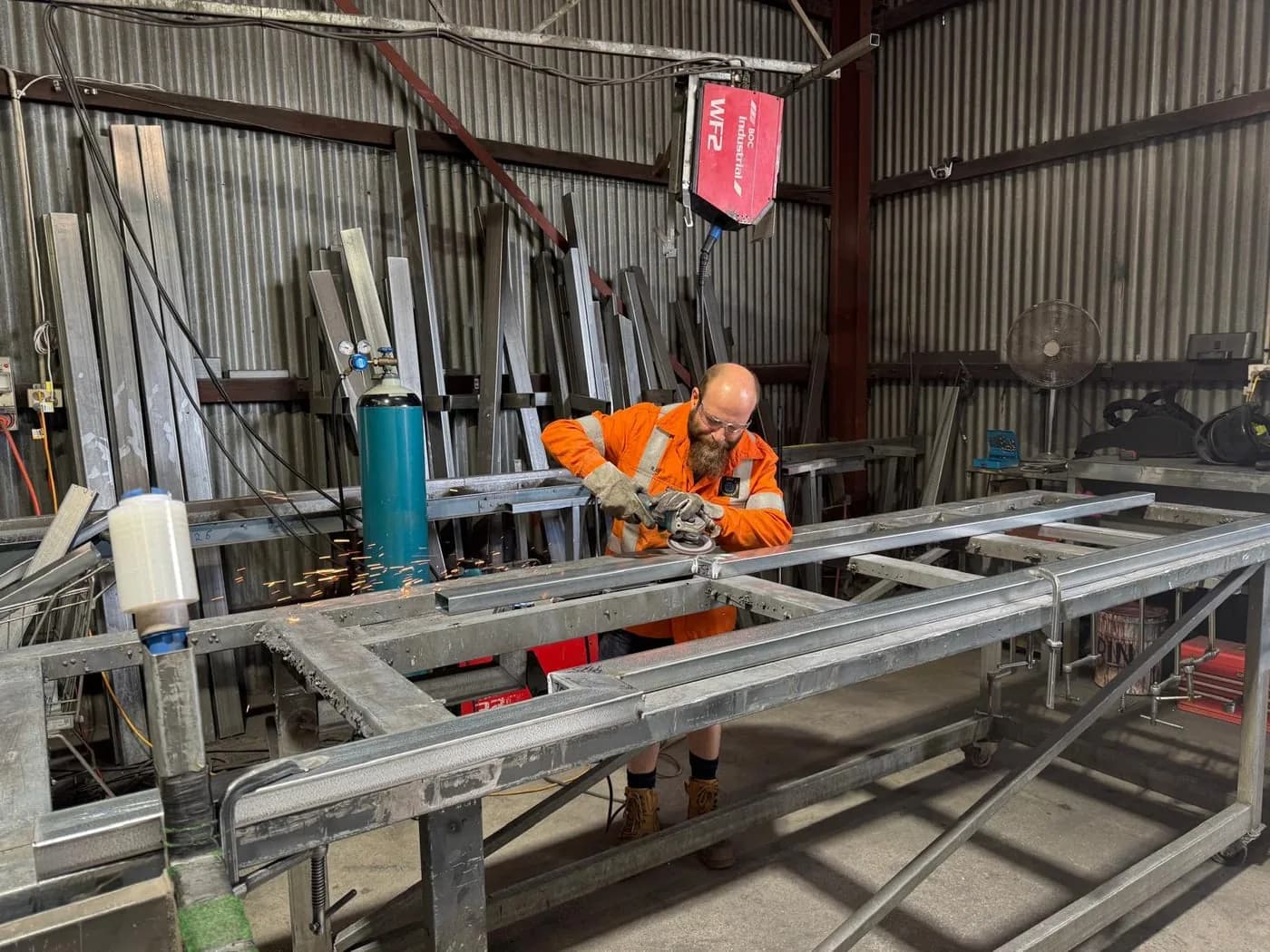 A steel patio frame being assembled on a jig in The Patio Factory's Welshpool workshop